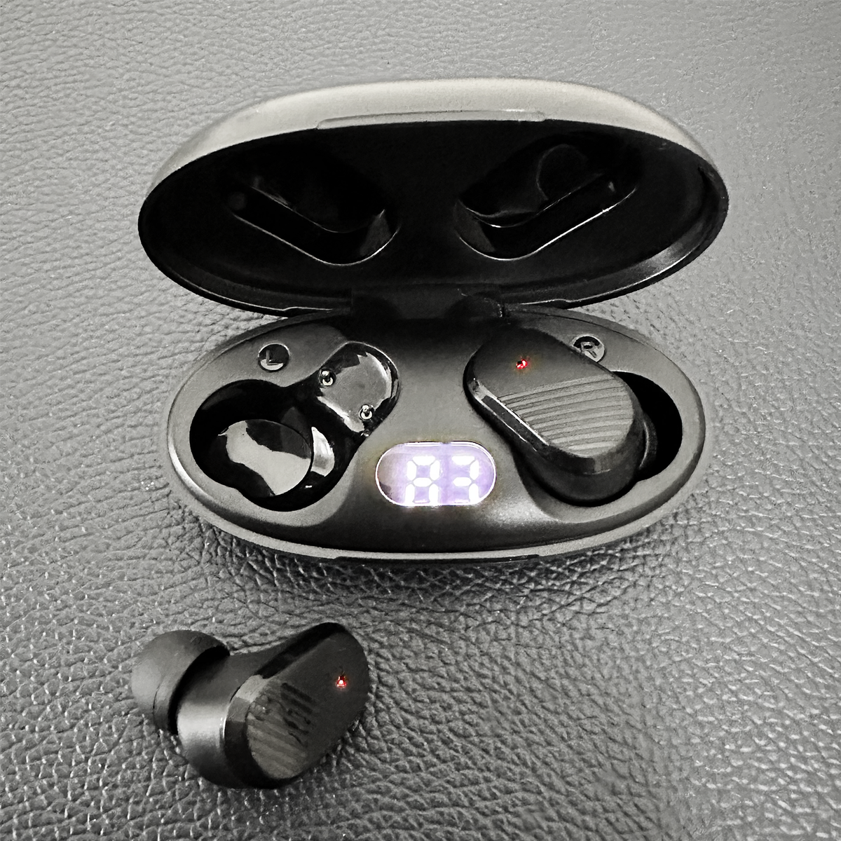 Woman wearing EchoLabs earbud outdoors